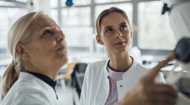 Healthcare workers looking at a screen