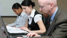 Group of workers with laptops