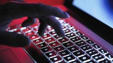 hand on backlit laptop keyboard