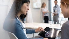 Doctors reviewing a patient's brain scan