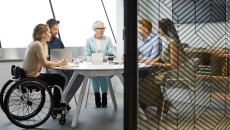 A diverse set of colleagues in a board meeting