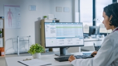 A doctor reviewing a patient's chart 