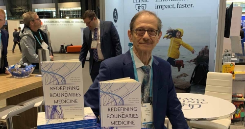 Man standing behind books