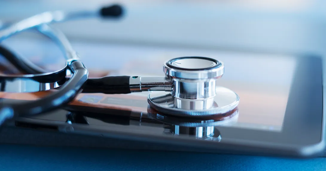 iPad with stethoscope on top