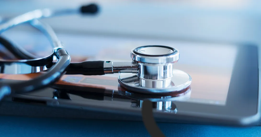 Stethoscope resting on tablet