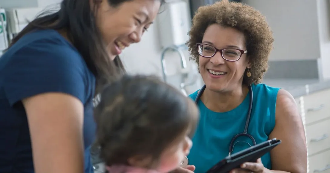 Doctor speaks with mother and child